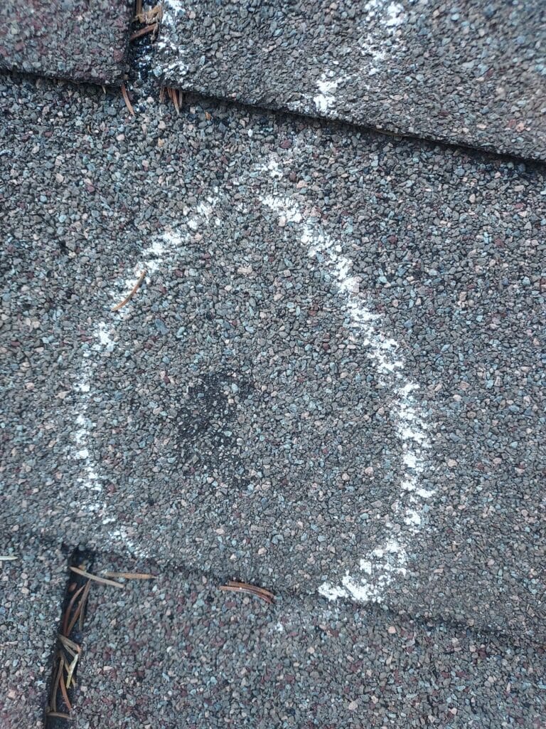 Hail Damage To Shingles Found During Roof Inspection